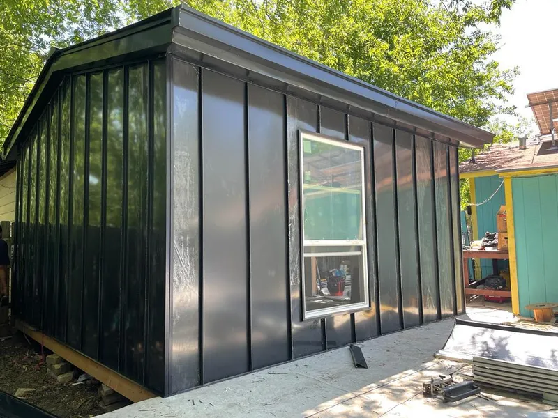 Black standing seam metal wall panels for Roof Inspection in Longwood